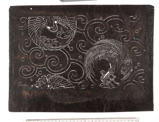 Katagami stencil depicting roundels of a crane and a hairy tailed tortoise on a background  of scrolling waves