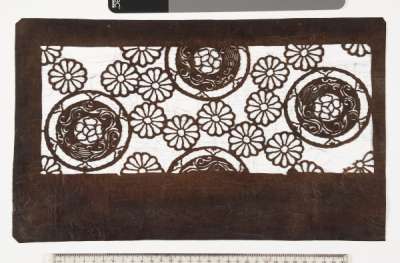 Katagami stencil with a design of chrysanthemums, and roundels with a plum flower in the centre, bordered by bell flowers and scrolling stems