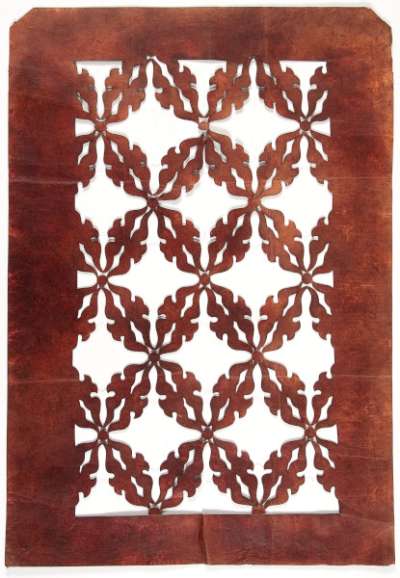 Export Katagami stencil with an all-over design of stylised foliage linked into a diagonal lattice.   The design may also reflect overlapping ovals which represent shippō  (gems  representing the Seven Treasures)