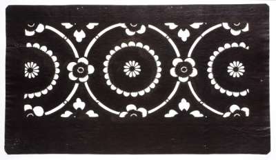 Katagami stencil with a pattern of circles containing, and linked by, flowers and hanabashi   (diamond shaped flowers).