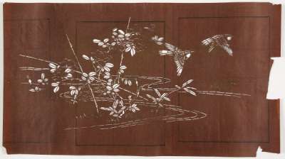 Katagami stencil depicting a rose growing up a bamboo frame on the edge of water with  bamboo growing nearby and birds flying off