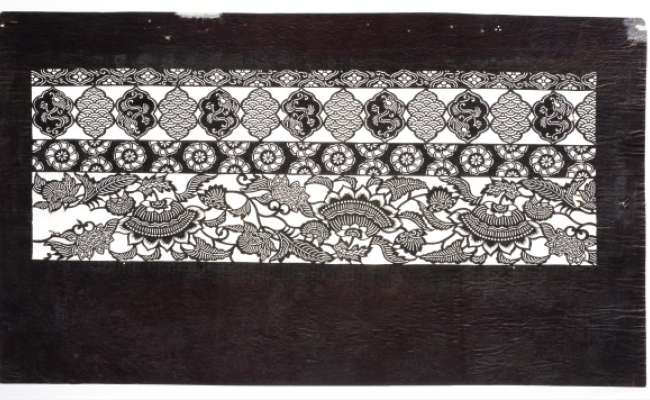Katagami stencil with rows of patterning containing: hanabashi  (flower diamonds) and  seigaiha  (waves from the blue ocean), flower heads, and scrolling floral designs imitating  chintz