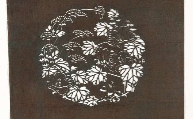 Embroidery Katagami stencil with a roundel containing flowering stems of hibiscus and eastern valerian  or water dropwort