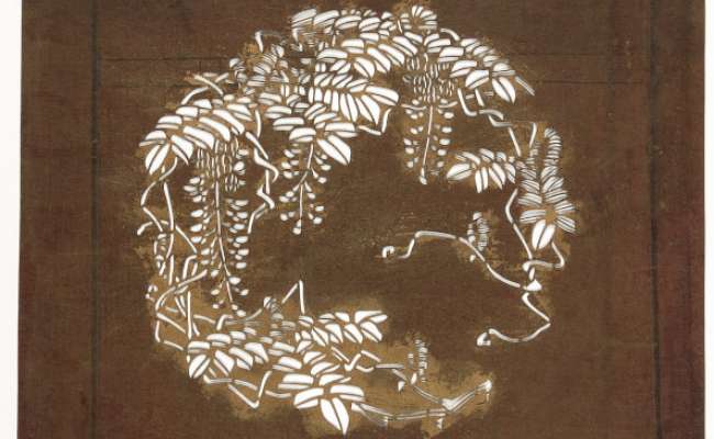 Embroidery Katagami stencil depicting a roundel of flowering wisteria stems