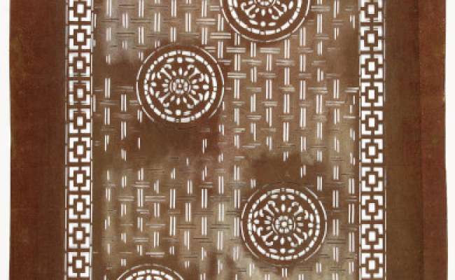 Export Katagami stencil with a design of floral roundels against a background of stylised woven patterning