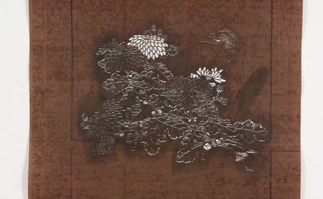 Katagami stencil depicting flowering chrysanthemum stems with butterflies flying nearby
