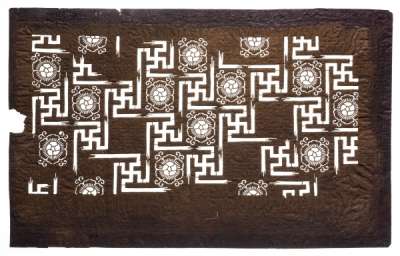 Katagami stencil with a pattern of manji tsunagi  – linked swastikas (a Buddhist auspicious  symbol and Japanese symbol of virtue) and karahana  (highly stylised ‘Chinese flowers’)