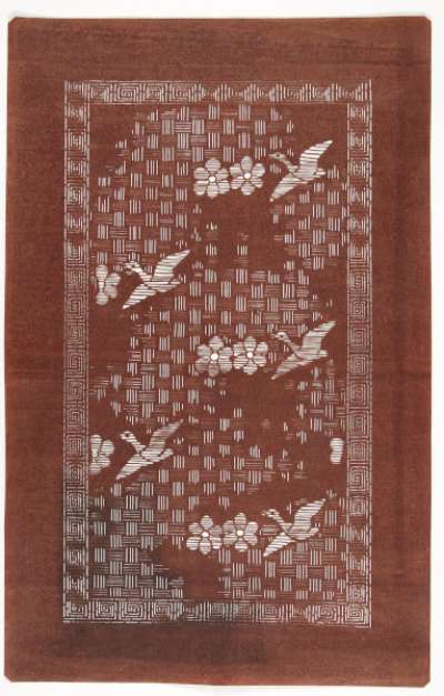 Export Katagami stencil depicting ducks or geese and flowers against a background with a weave  pattern.  The border has a geometric design of angular spirals