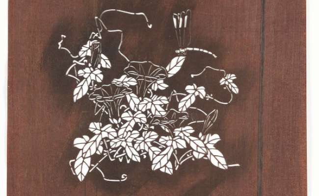 Embroidery Katagami stencil depicting a dragonfly perched on a flowering bindweed stem