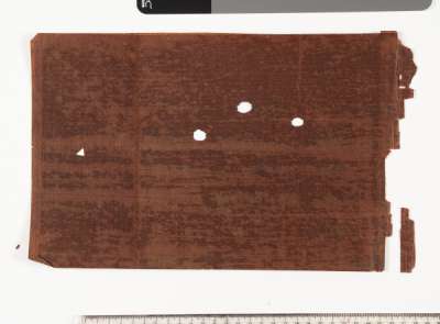 Sheet of mulberry bark paper with three small cut out shapes – a triangle and three circles with scalloped edges