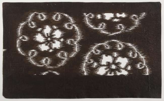 Katagami stencil depicting large snowflake roundels containing flowers