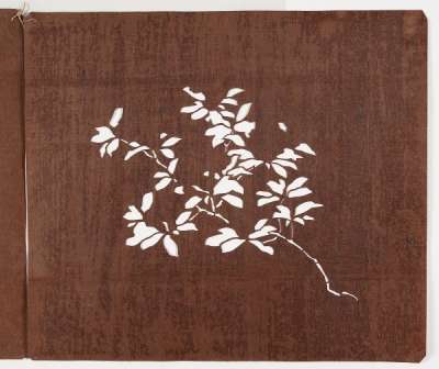 Three katagami stencils which together form a design of flowering stems