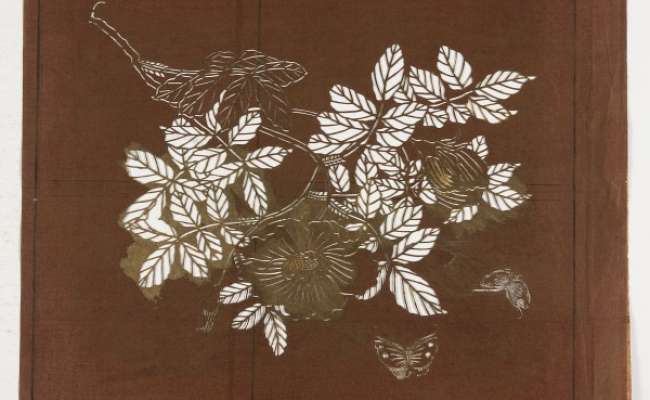 Katagami stencil depicting a flowering branch with two butterflies flying nearby