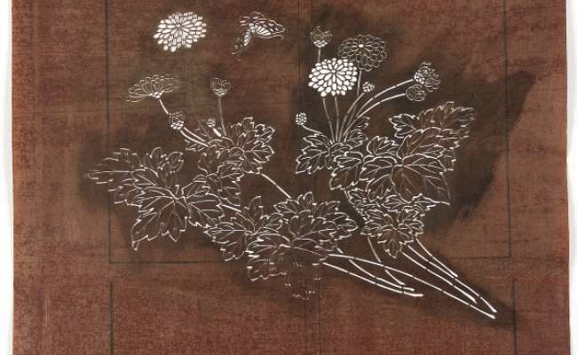 Katagami stencil depicting flowering chrysanthemum stems and a butterfly