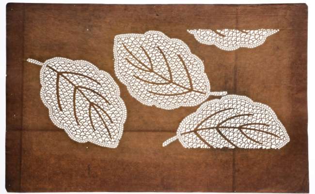 Katagami stencil with a design of leaves with reticulated patterning.  The design of fallen  leaves may be for Autumn.