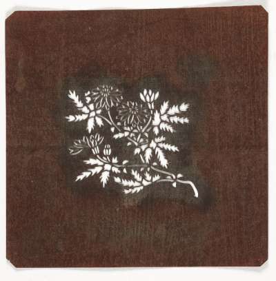 Embroidery Katagami stencil depicting a chrysanthemum plant, associated with Autumn