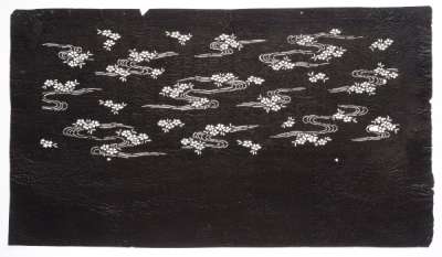 Katagami stencil depicting cherry blossom floating on water, imagery associated with late- Spring