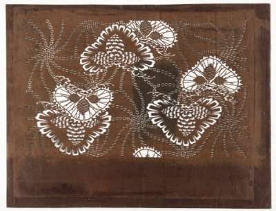 Katagami stencil with design of pine trees with pine cones and needles depicted on them  surrounded by rosettes of radiating lines produced in a style which imitates a tie dye  technique – tatebiki kanoko