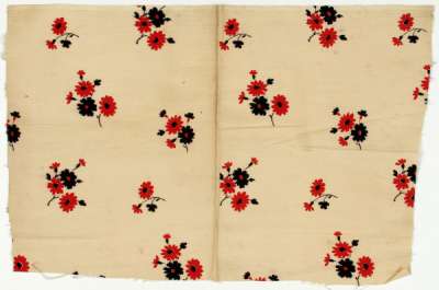 Red and black flowers on cream and blue and white flowers on pale blue