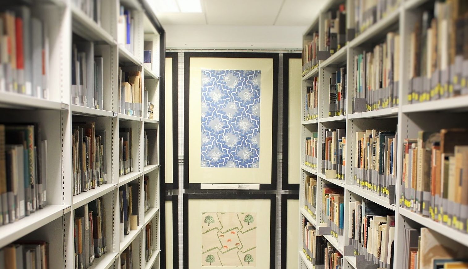 Shelving, books and framed wallpapers in the MoDA collection store