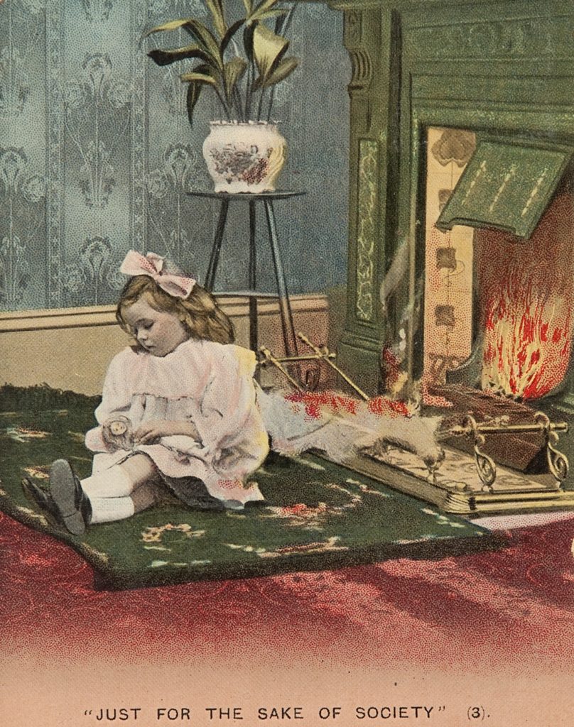 small girl sitting on floor falling asleep in front of open fire with articles behind her on fire