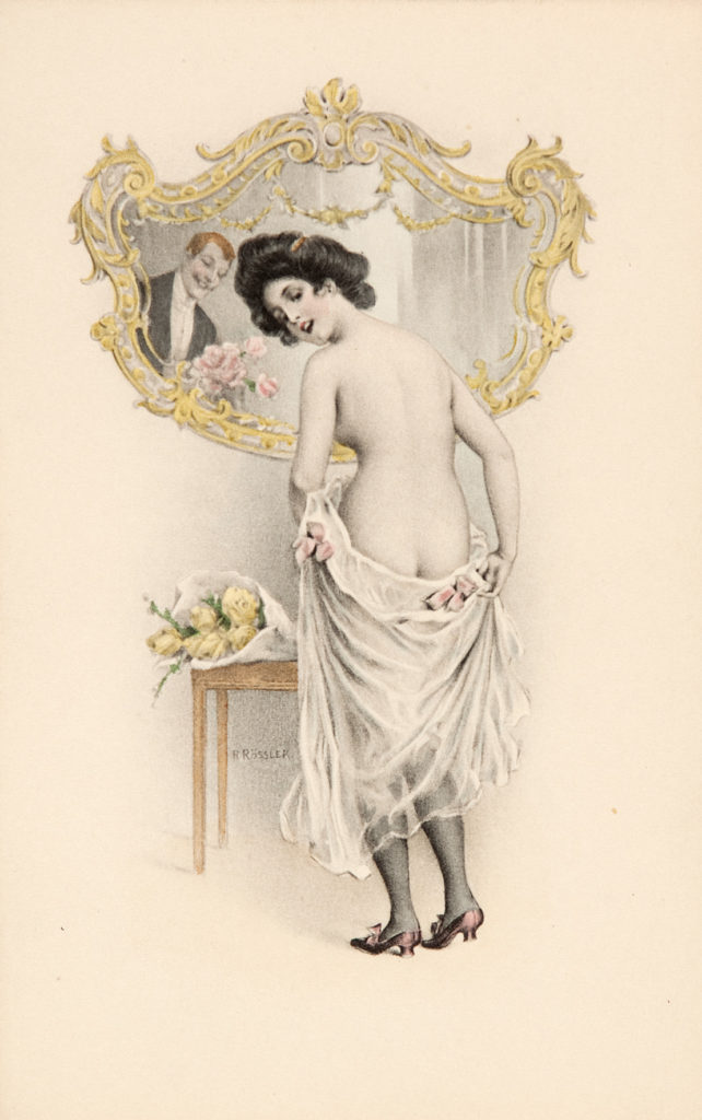 image showing woman partly clothed looking over her shoulder while mirror in front of her reflects man holding bunch of flowers