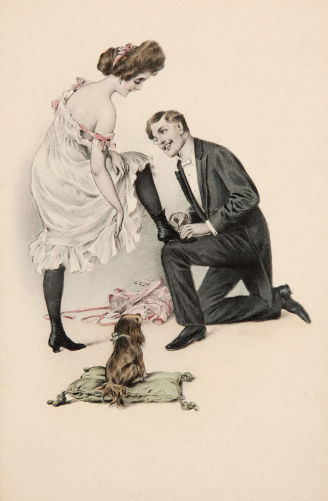 monocled man kneeling doing up the laces of the boot for a woman in underwear as a dog sits on a cushion watching