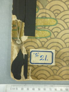 detail of binding showing black adhesive tape